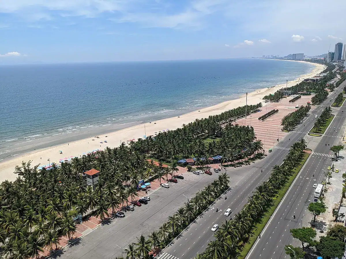 An elevated view of My Khe Beach's long shoreline and the city behind it.