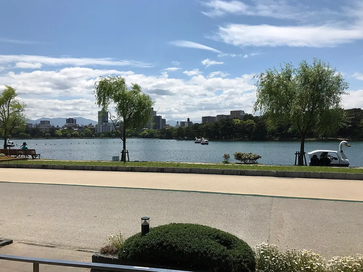 The large lake and lakeside path of Ohori Park in Fukuoka.