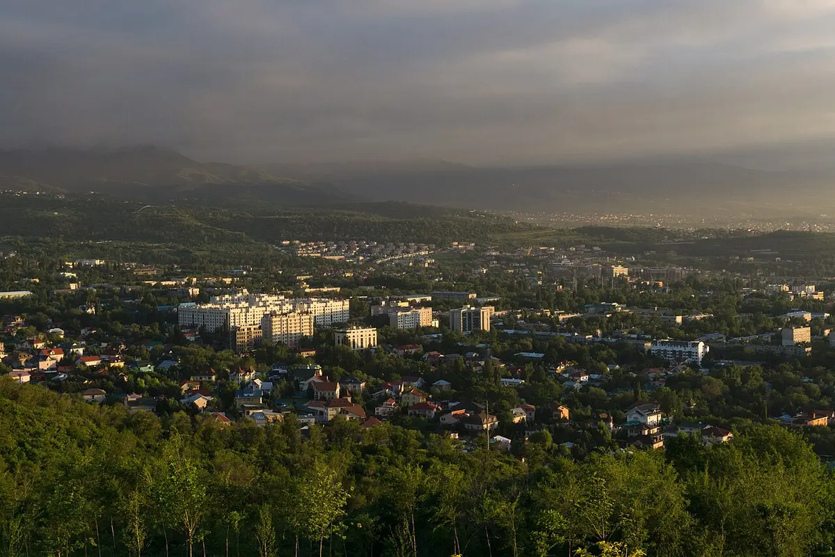 Almaty's city spread out below, seen from a hillside