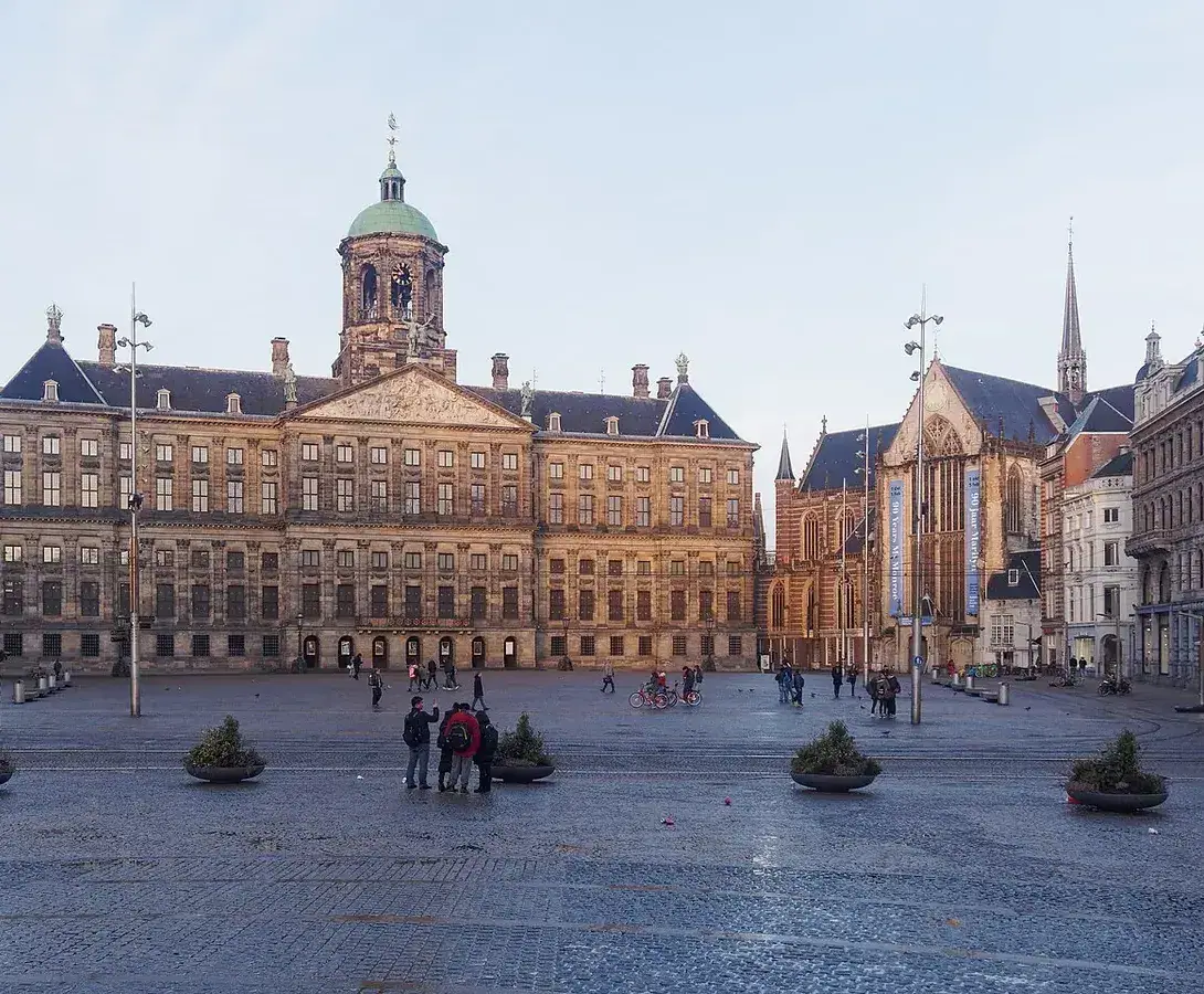 The Royal Palace of Amsterdam and the adjacent Nieuwe Kerk seen across Dam Square.