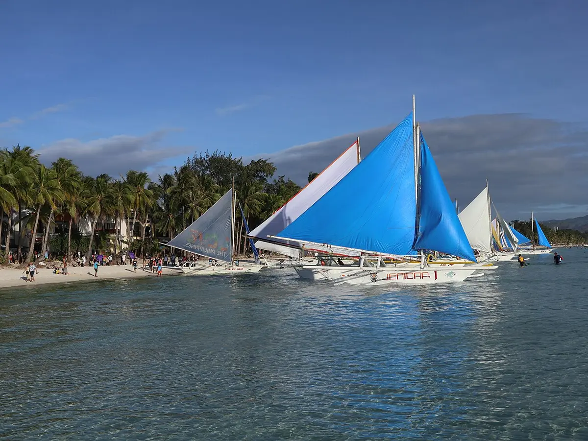 Paraw sailboats on the water off White Beach