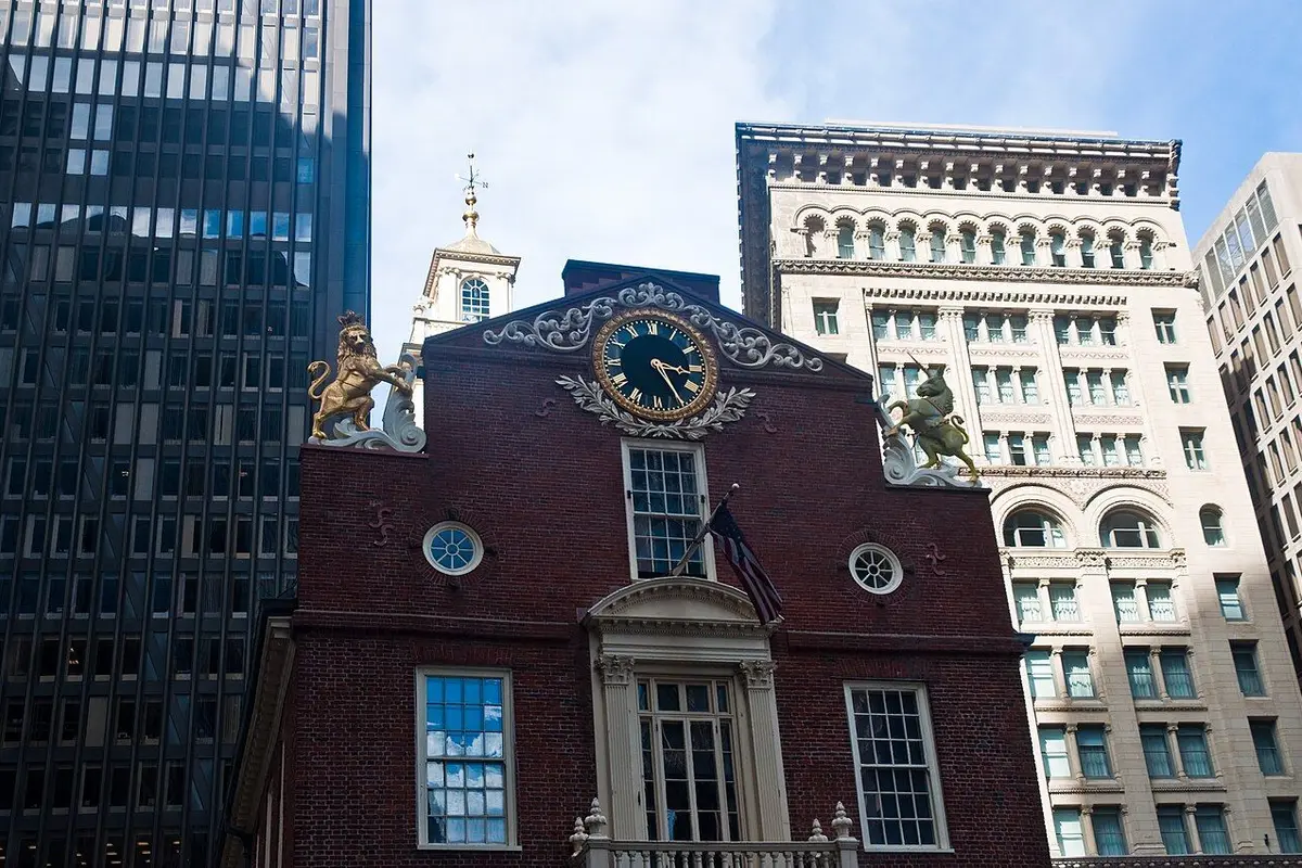 The east gable of the Old State House, with its clock and gilded lion and unicorn, framed by modern office towers.