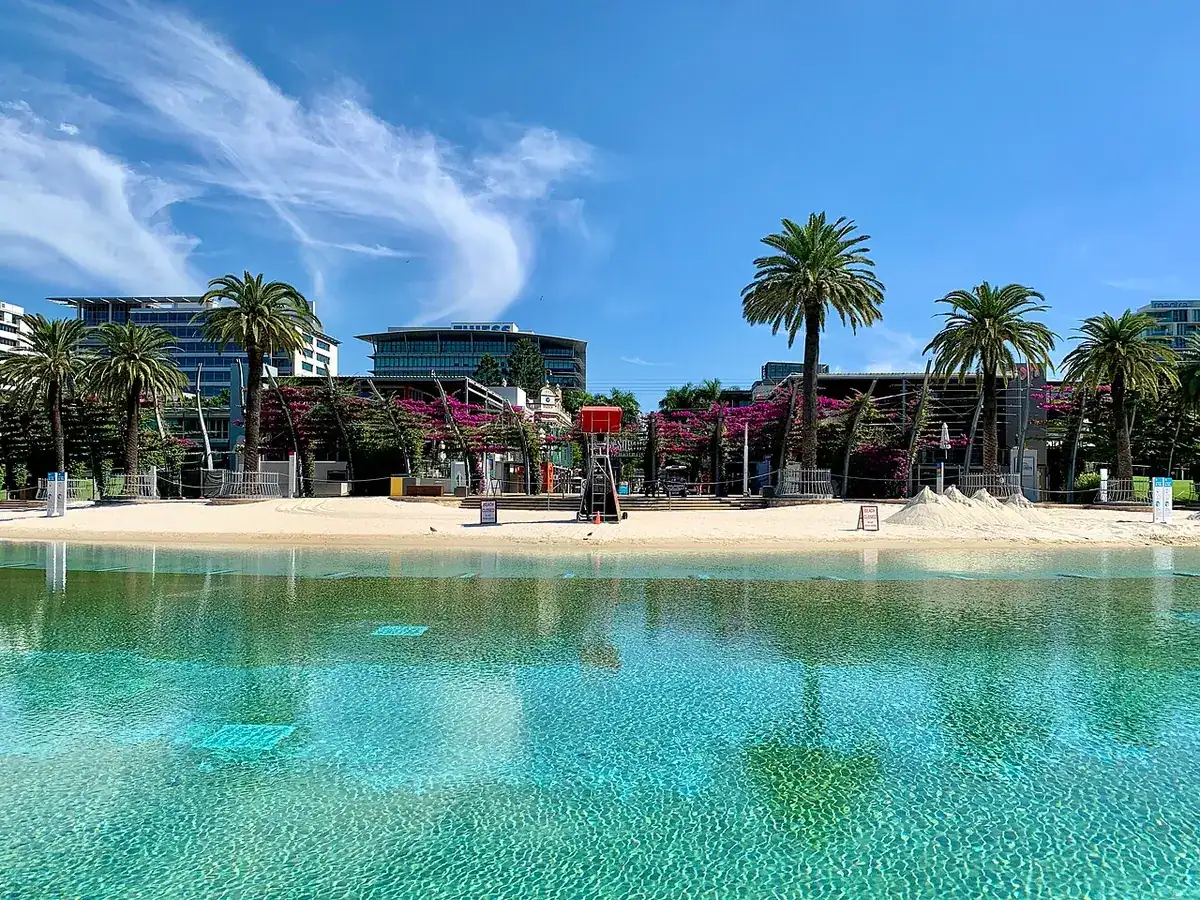 The empty sand and swimming lagoon of South Bank's artificial beach