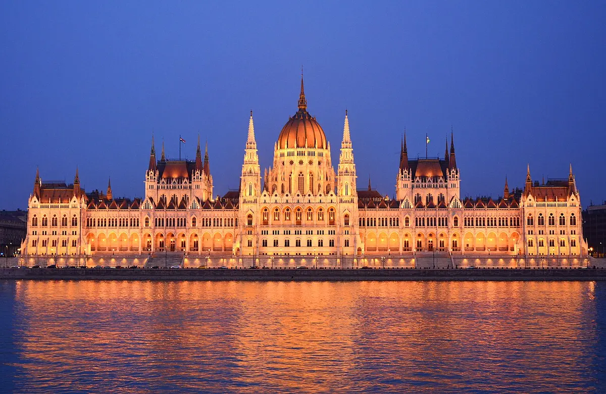 The Hungarian Parliament Building across the Danube, reflected in the water