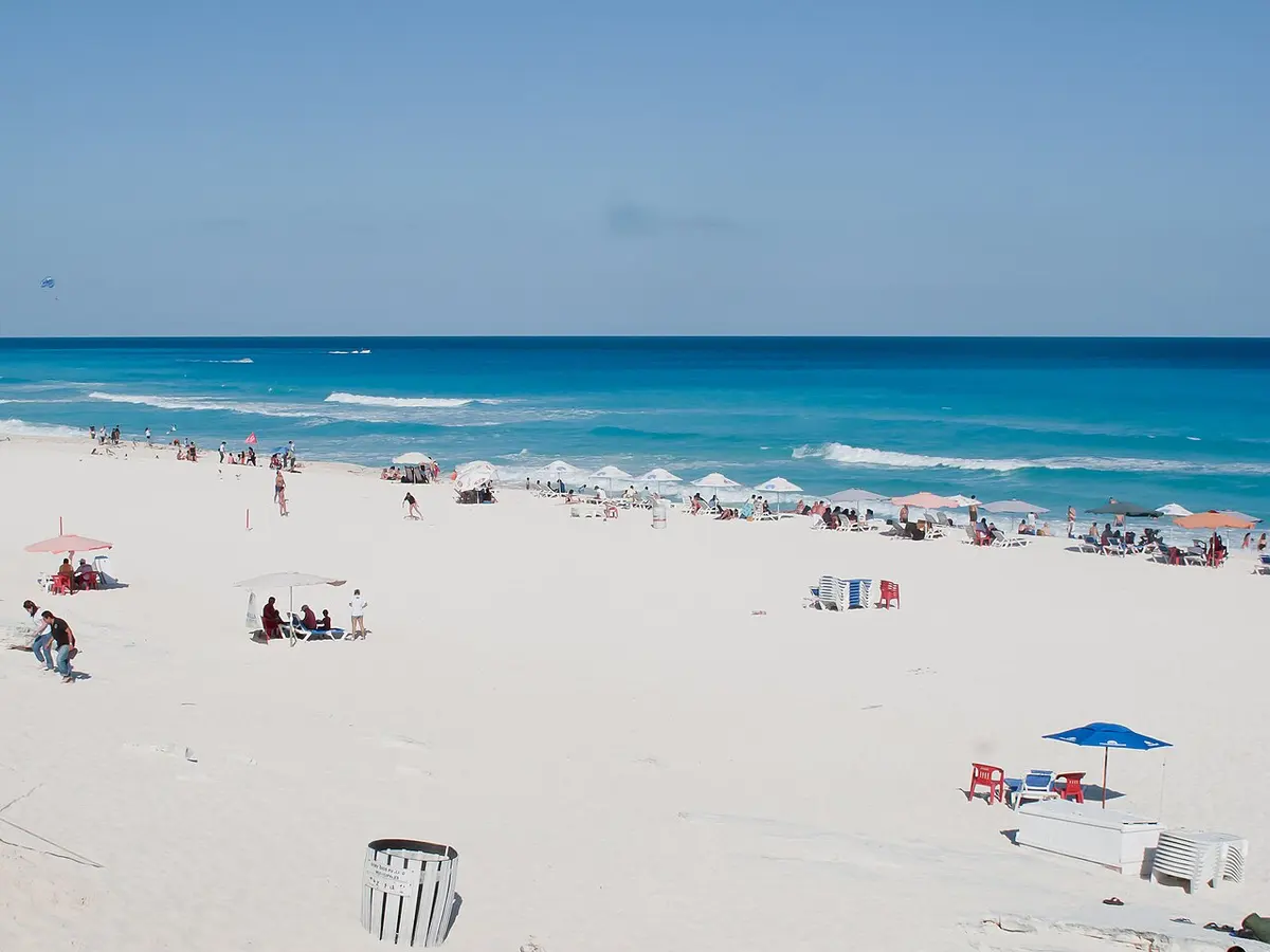 White sand and turquoise Caribbean water at Playa Delfines in Cancún's Hotel Zone.