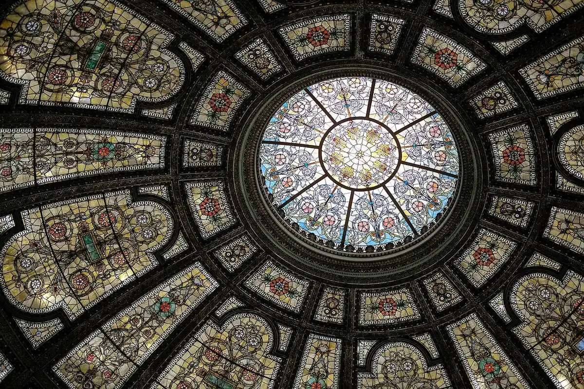 The ornate stained-glass dome in the ceiling of Preston Bradley Hall at the Chicago Cultural Center.