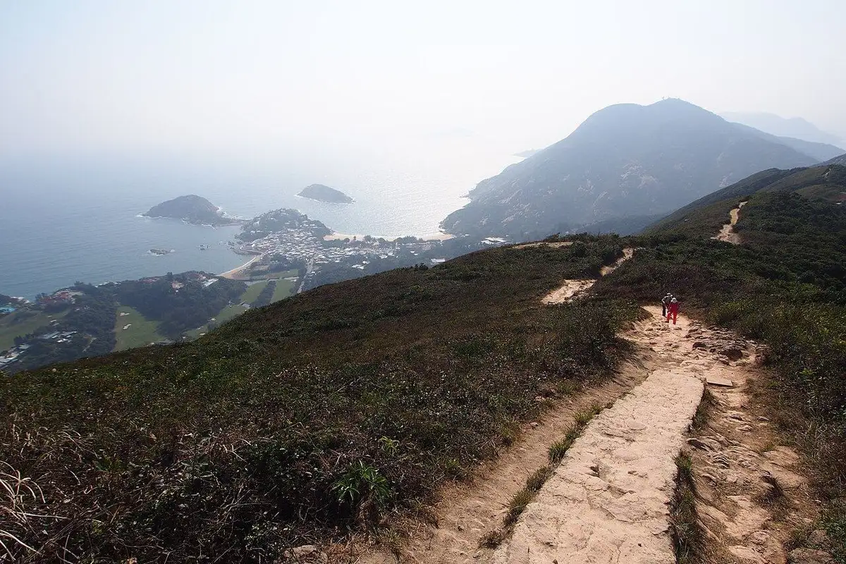 A stone path along the ridge looks down on Shek O village, its beach and small islands.