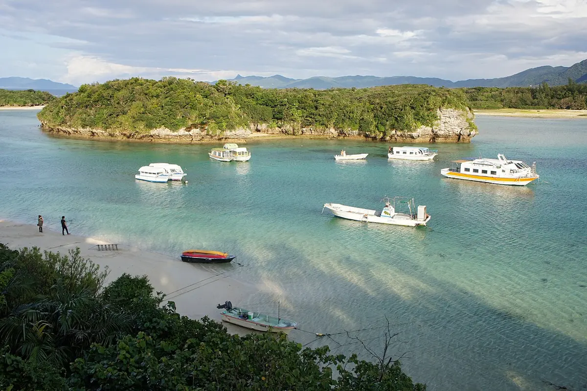 The emerald water of Kabira Bay on Ishigaki Island, dotted with small islands.
