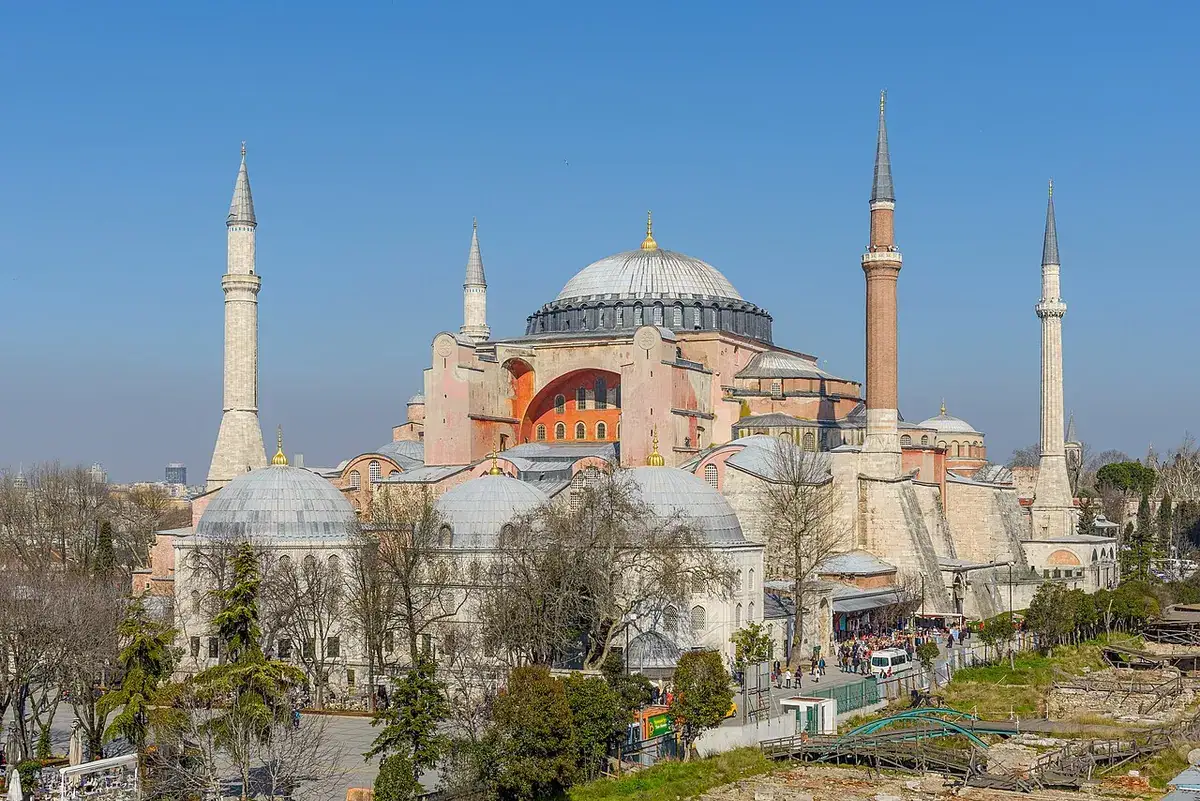 The great dome and minarets of Hagia Sophia under a blue sky