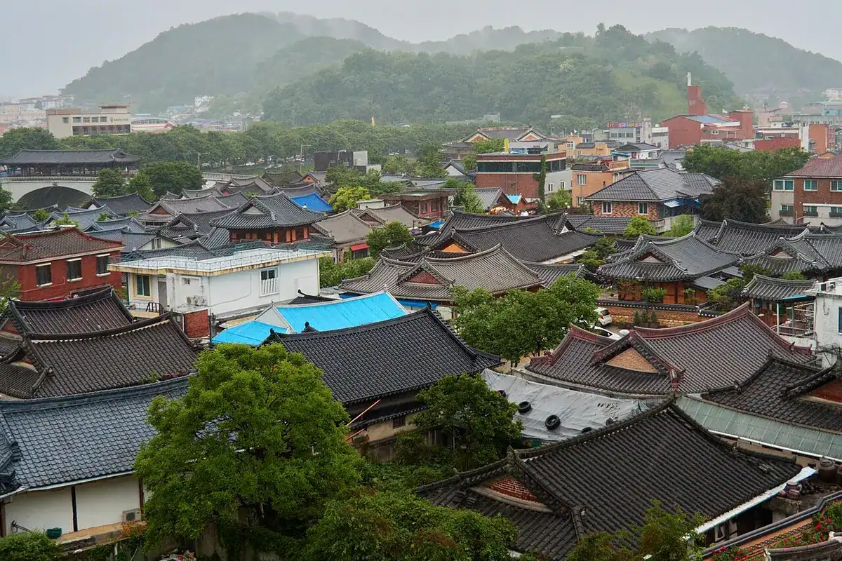 Densely packed tiled hanok roofs of Jeonju Hanok Village seen from above.