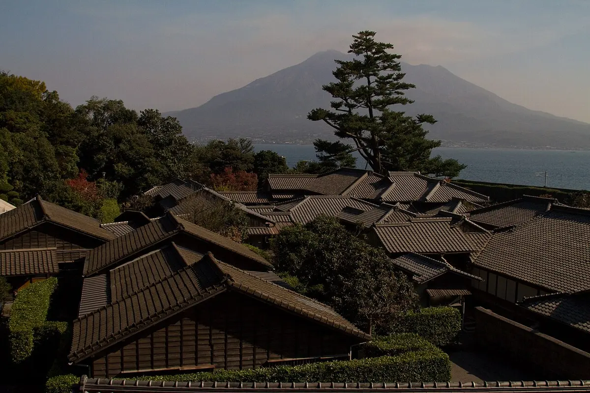 Traditional buildings of Sengan-en with Sakurajima volcano behind.