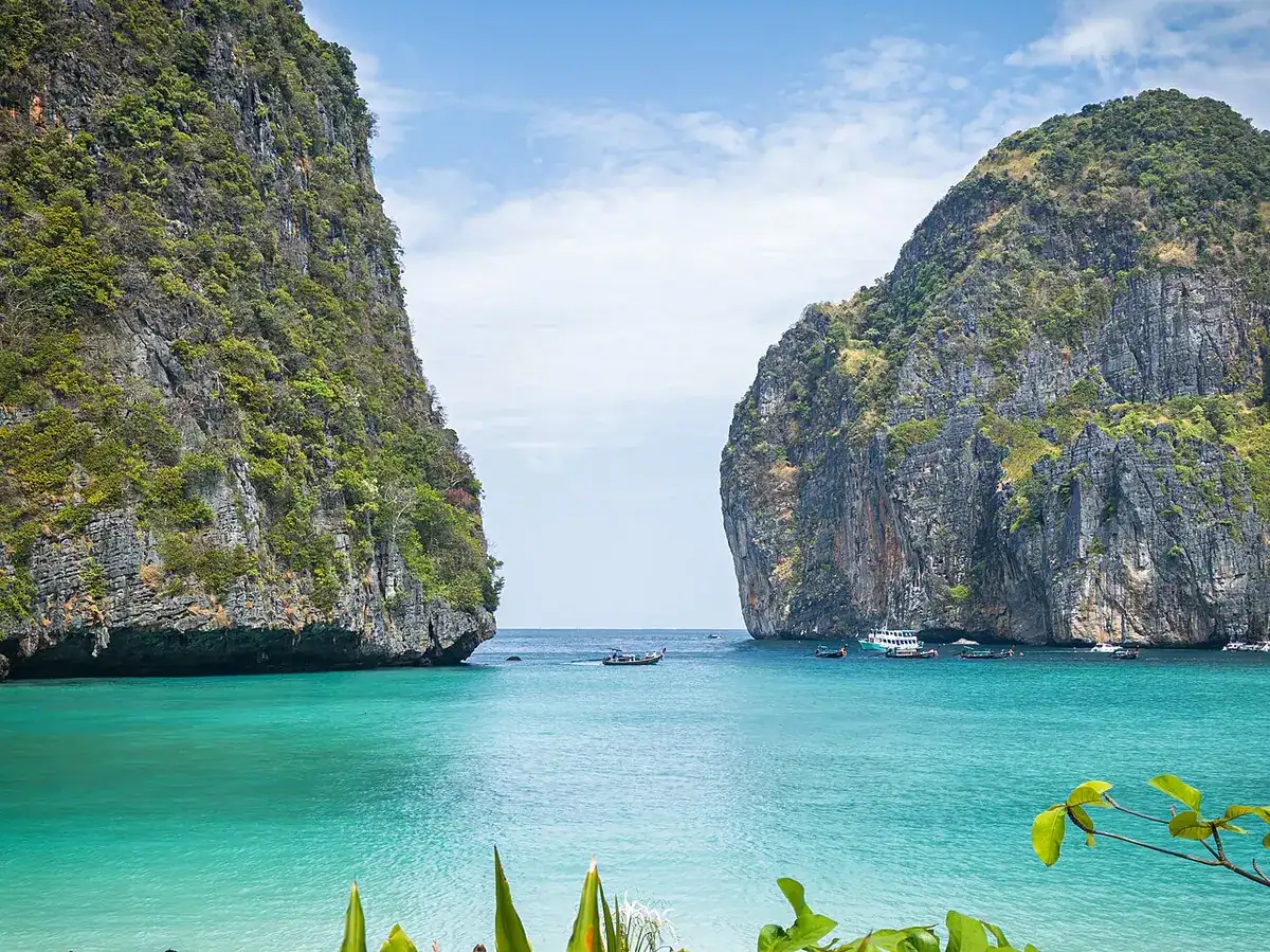 Turquoise water of Maya Bay enclosed by limestone cliffs