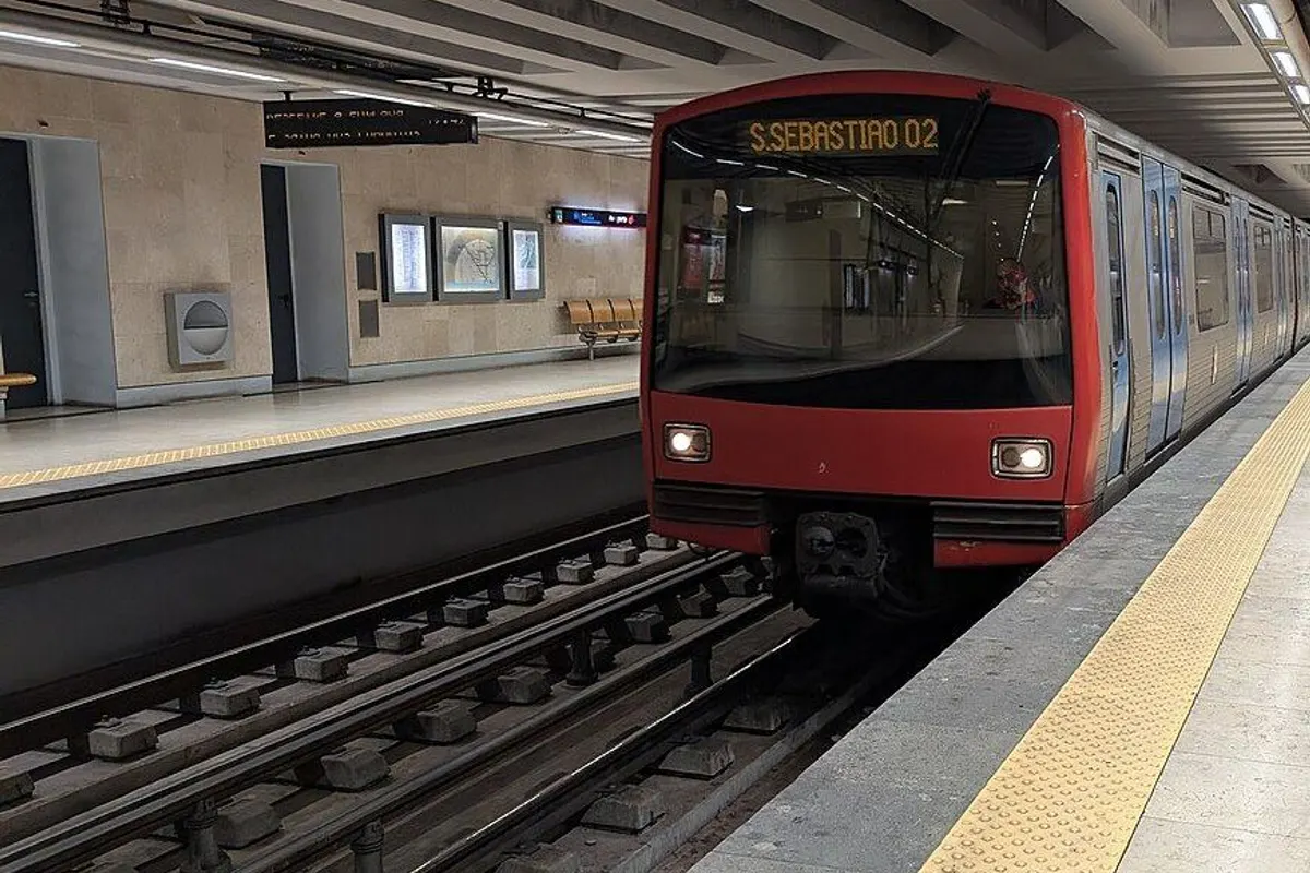 A Red Line train pulling into the underground platform at the airport.