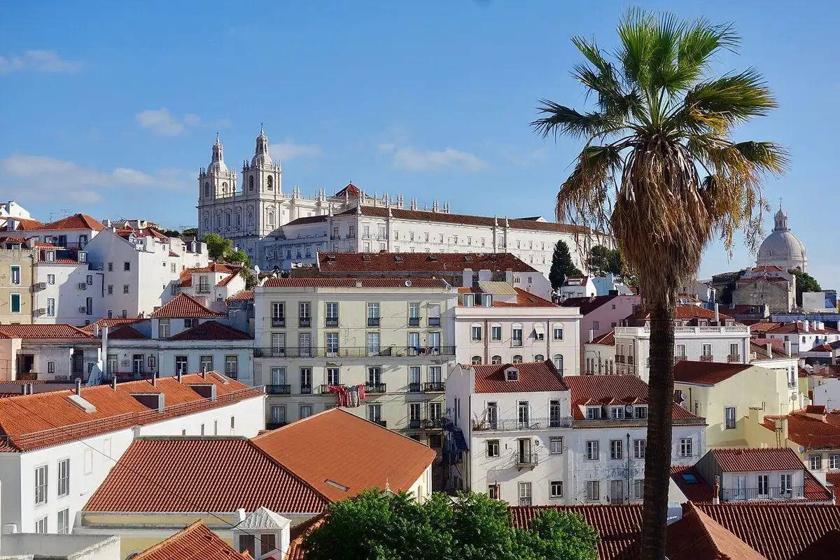 São Vicente de Fora monastery rising above Alfama's white houses and red roofs.