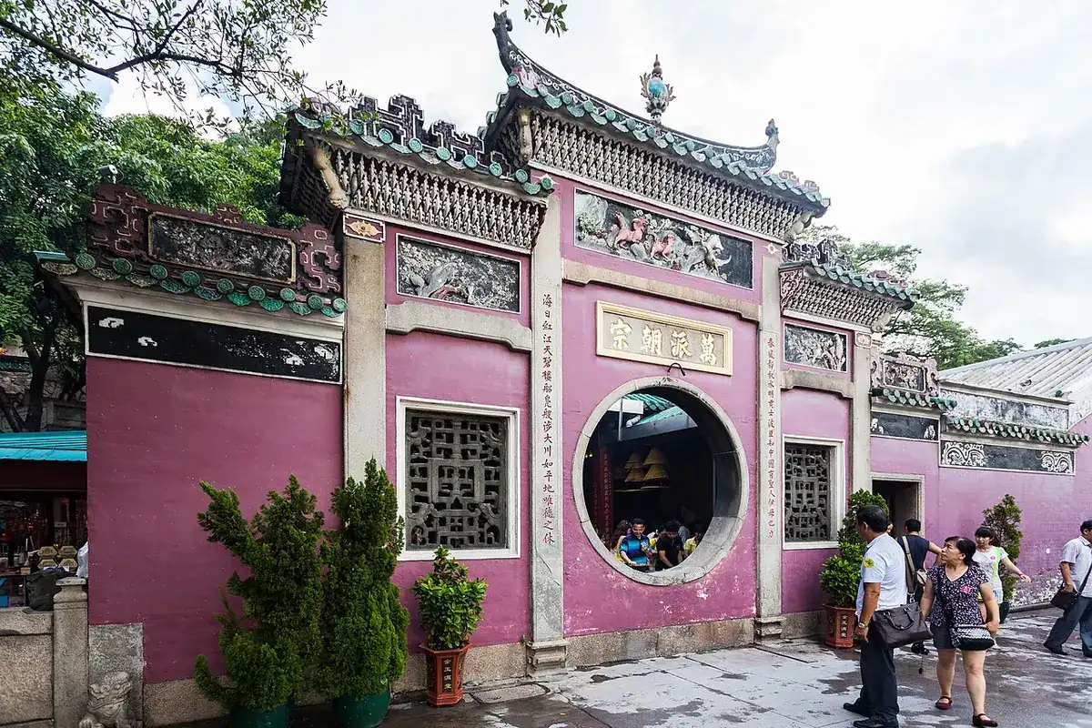 The red wall and round window at the entrance of A-Ma Temple in Macao