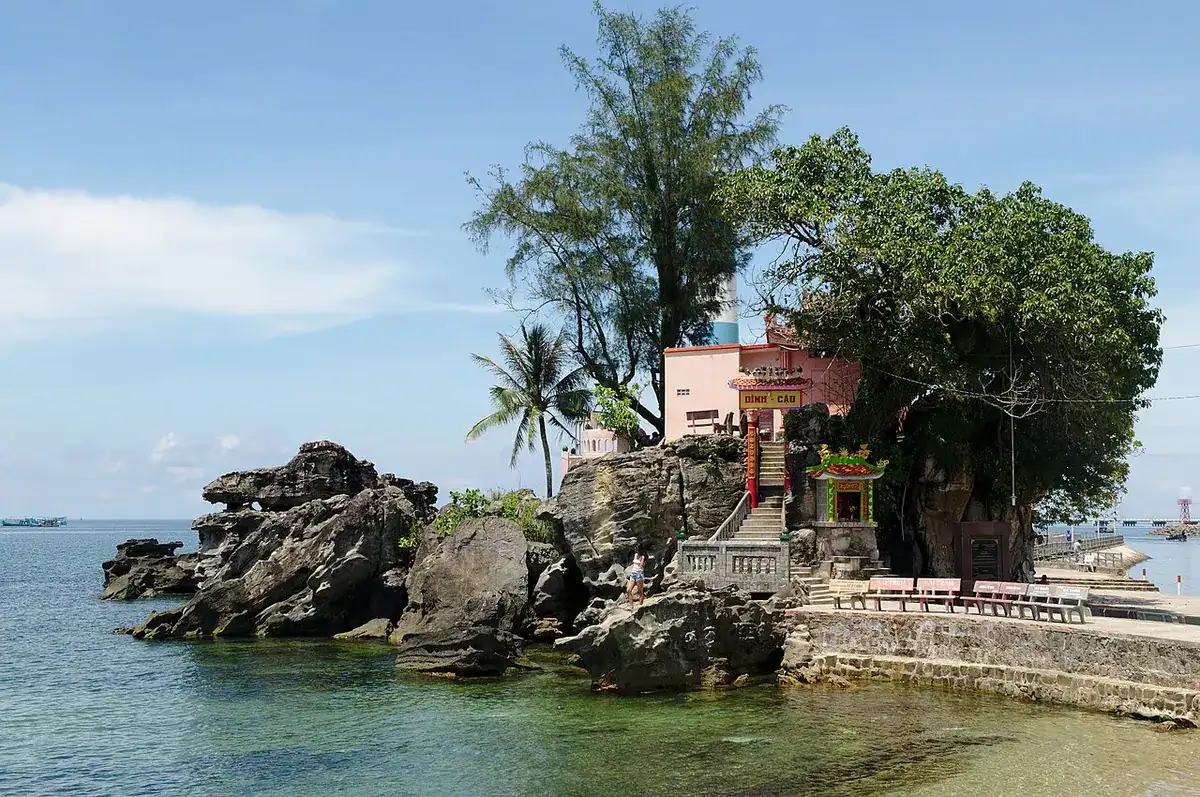 The Dinh Cau shrine on its rock at the Duong Dong river mouth