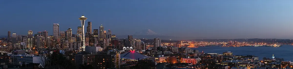 The Space Needle, downtown Seattle and distant Mount Rainier from Queen Anne Hill at dusk