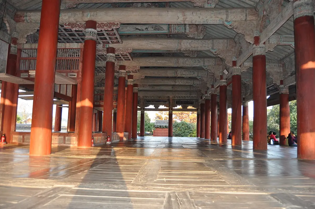 Rows of red wooden columns inside the open Sebyeonggwan Hall in Tongyeong.