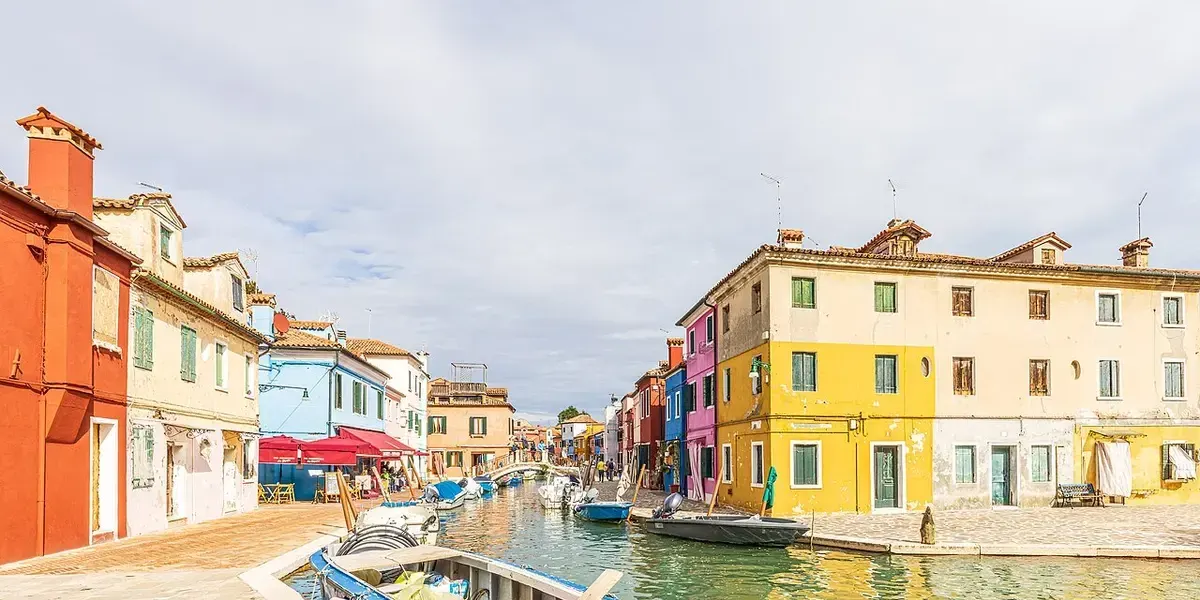 Brightly coloured houses lining a canal on the island of Burano.