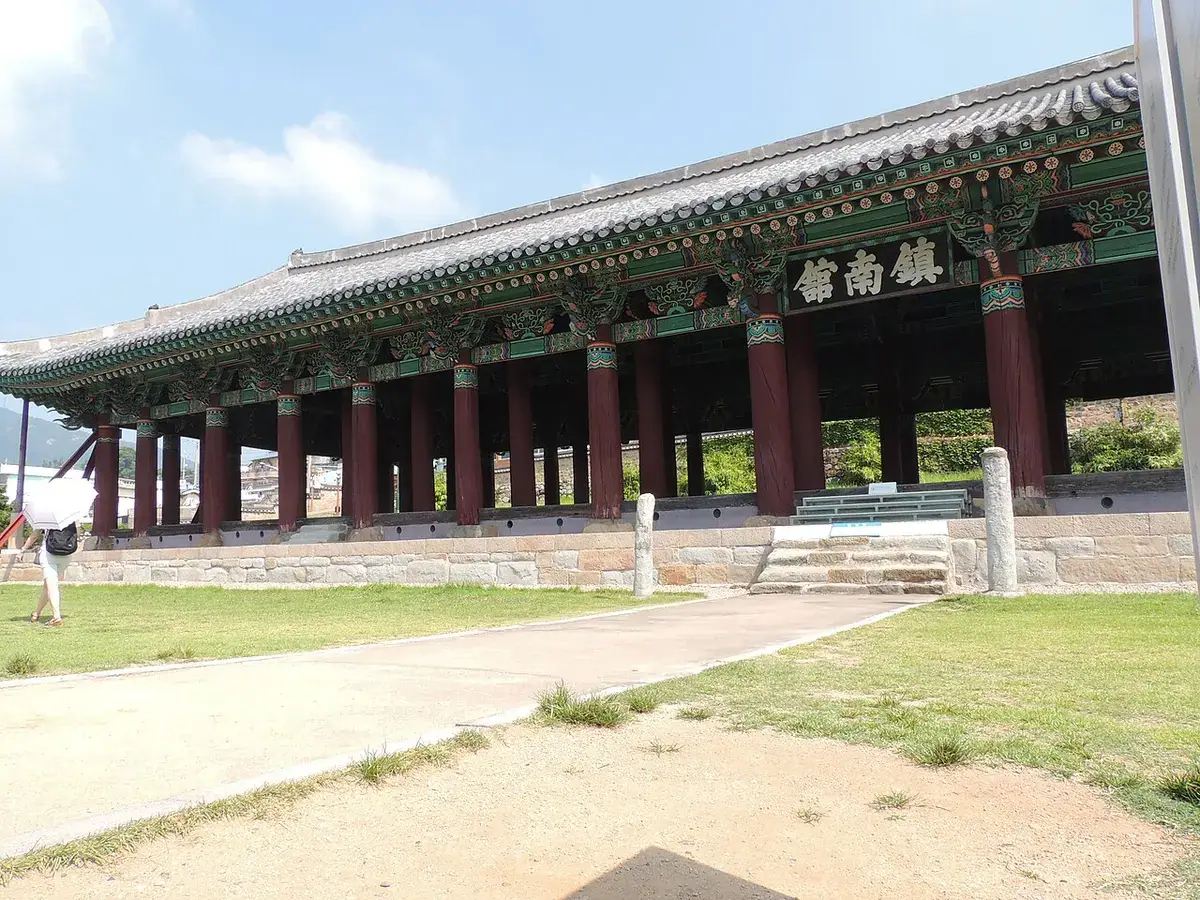 The tiled roof and long wooden hall of Jinnamgwan in Yeosu.