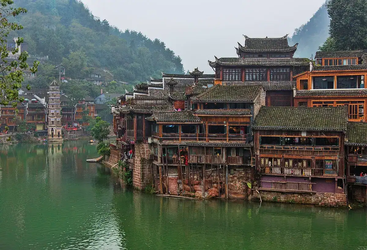 Wooden houses lining the river in Fenghuang Ancient Town