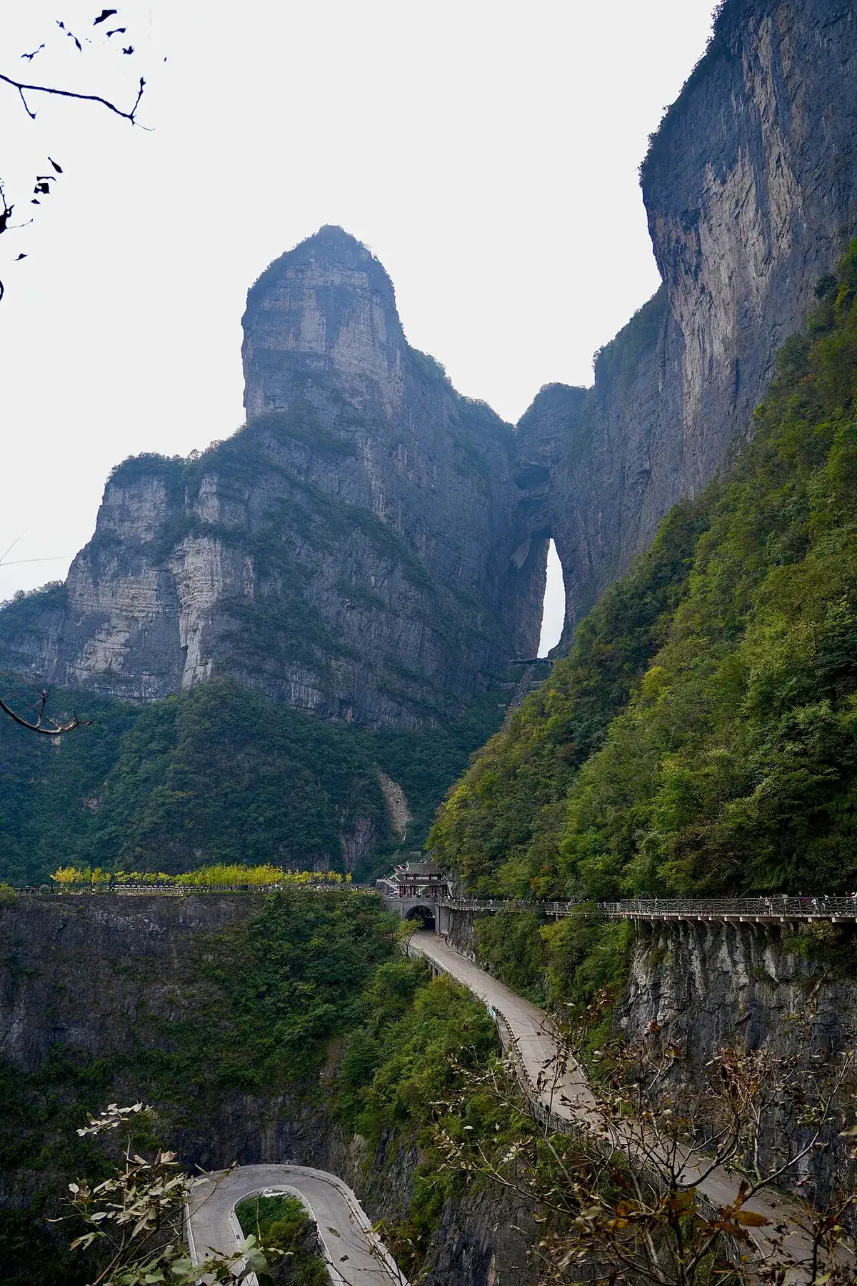 Tianmen Mountain's huge Heaven's Gate arch and its winding cliffside road