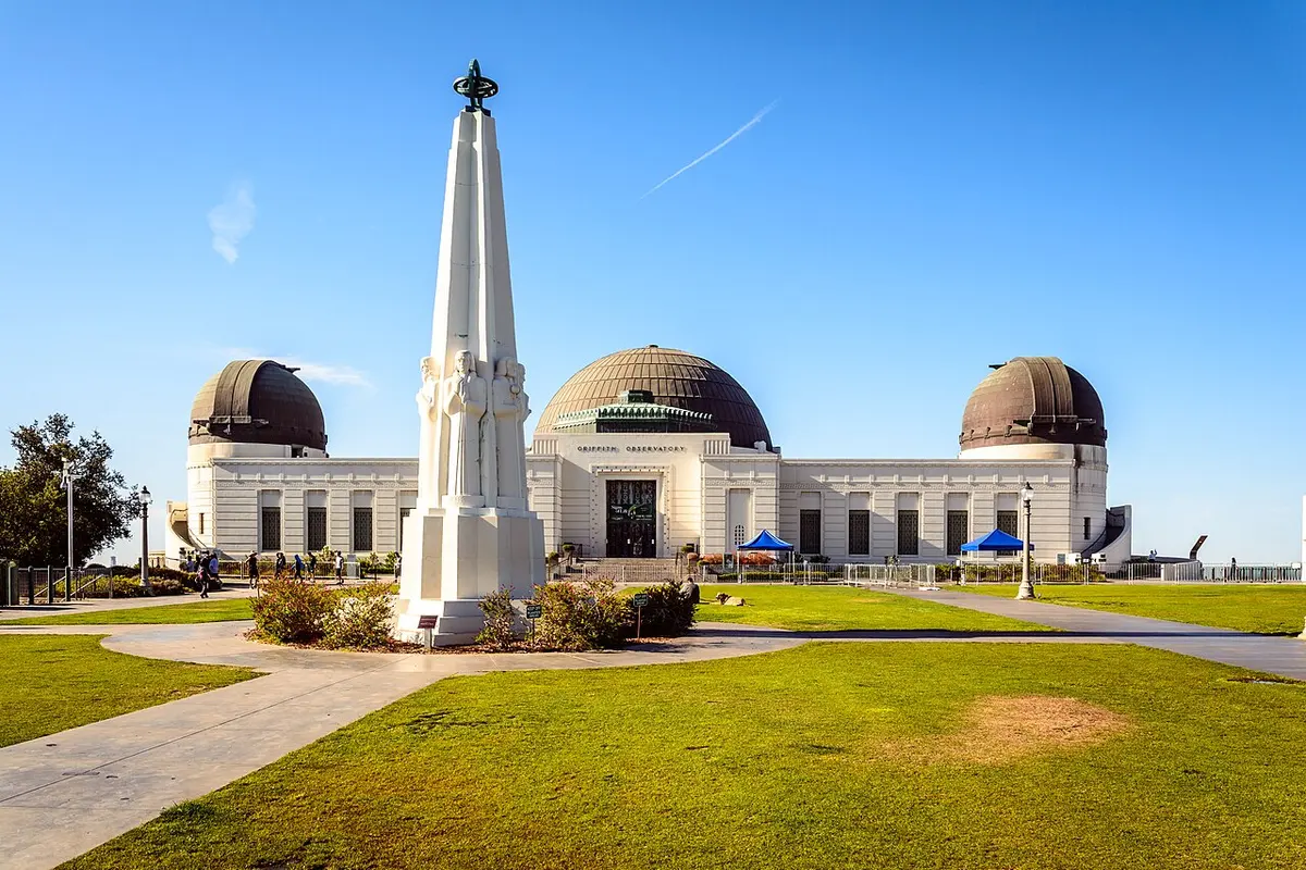 White domes of Griffith Observatory under a clear Los Angeles sky