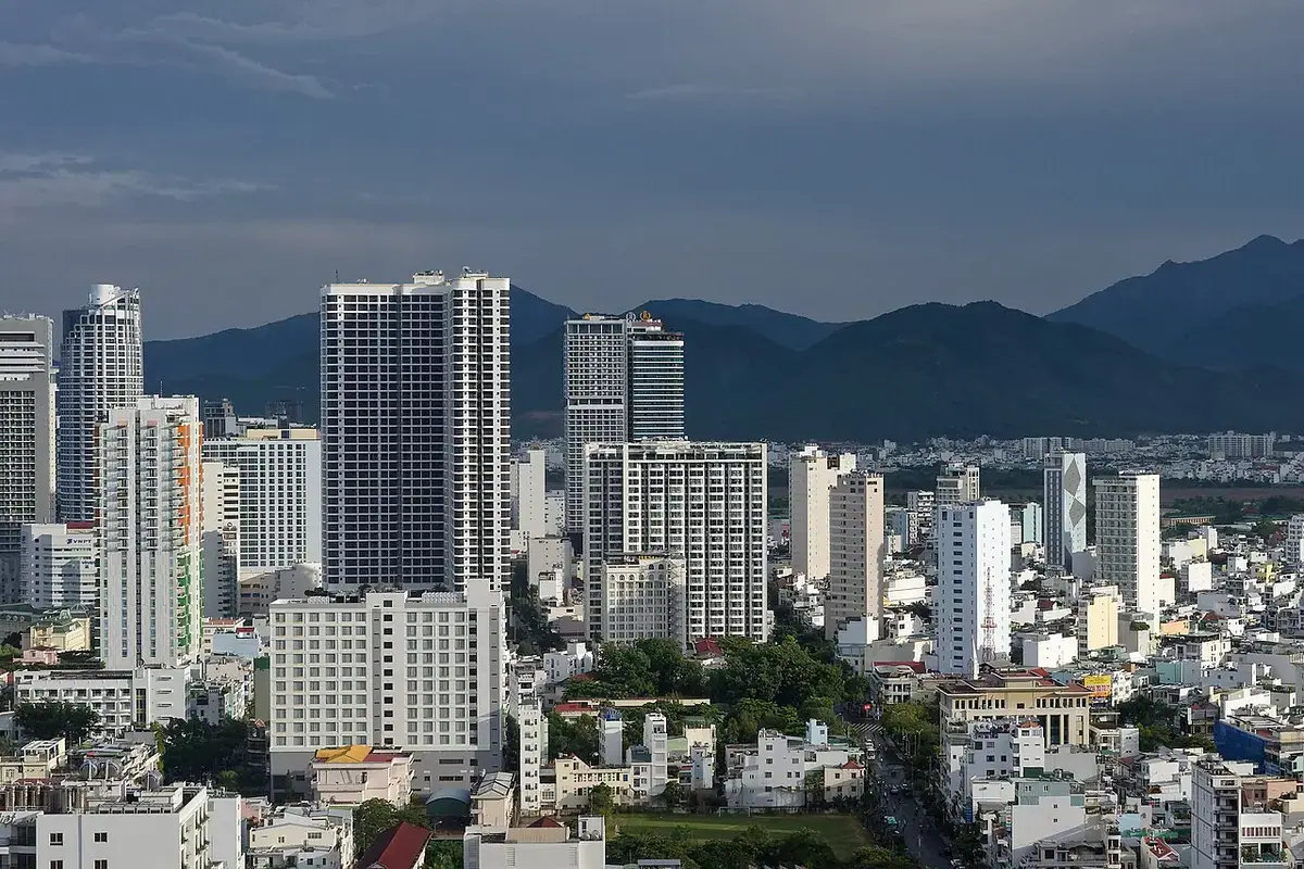 Nha Trang's high-rises seen from above, with mountains behind