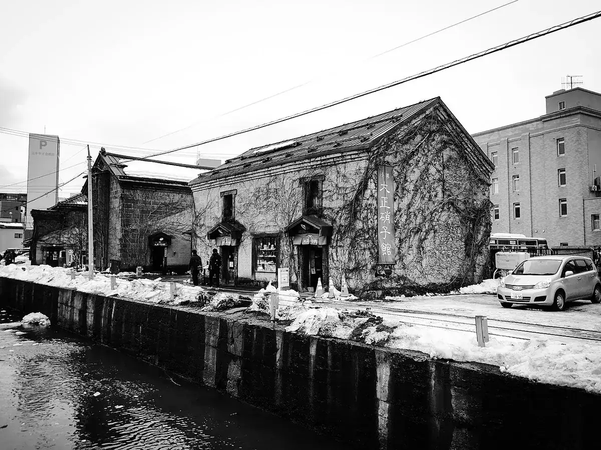 Old buildings lining Sakaimachi street in Otaru in winter.