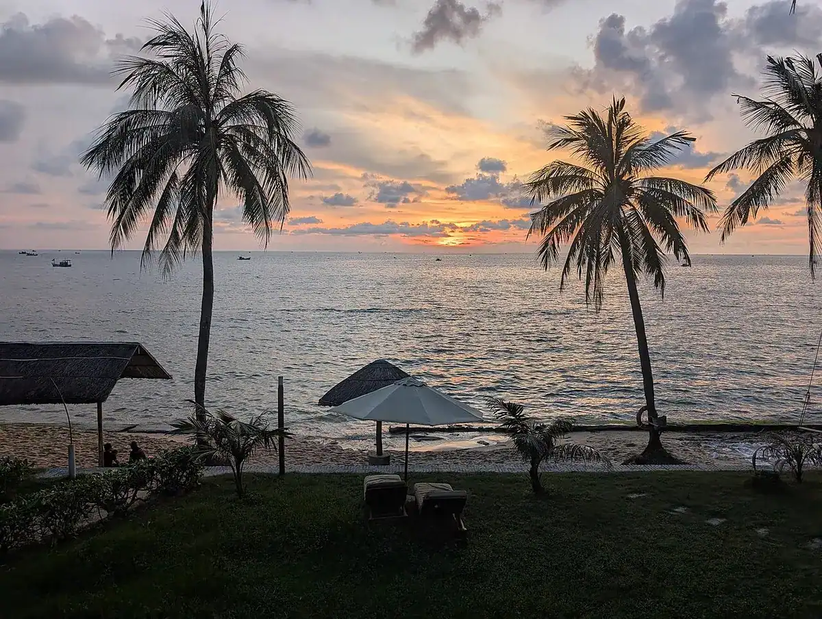 Sunset behind palm trees on Phu Quoc's west coast