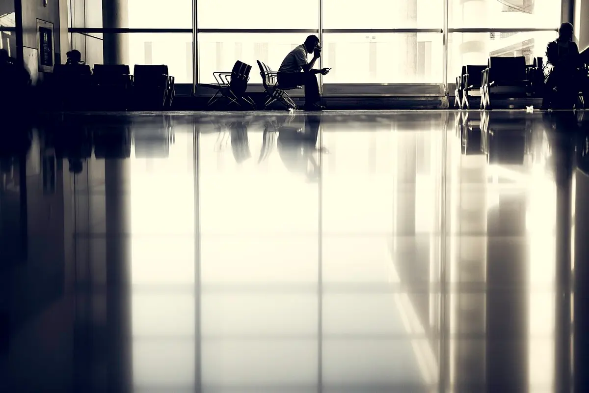 Waiting for a flight near an airport gate.