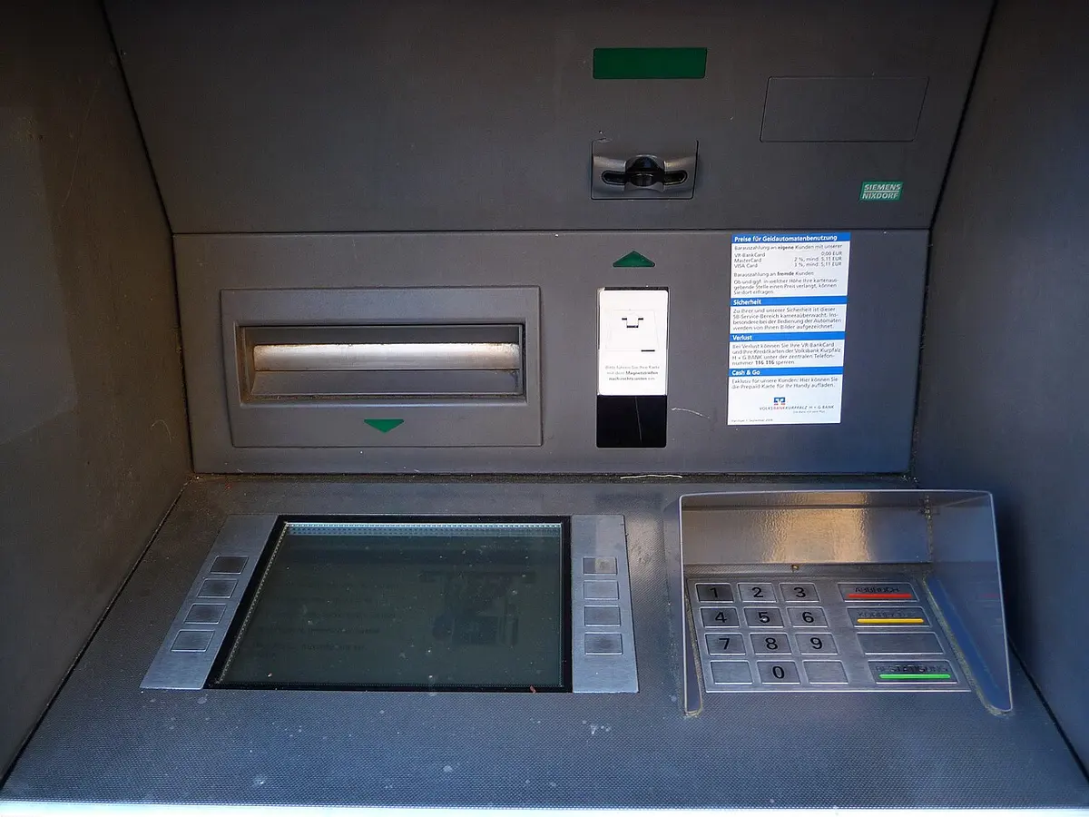 An ATM with a card slot, a screen and a keypad.