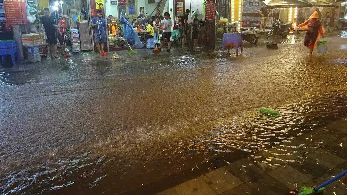 A rain-soaked street in Hanoi during an evening downpour.